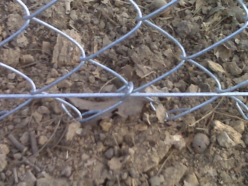 Chain link bottom tension wire